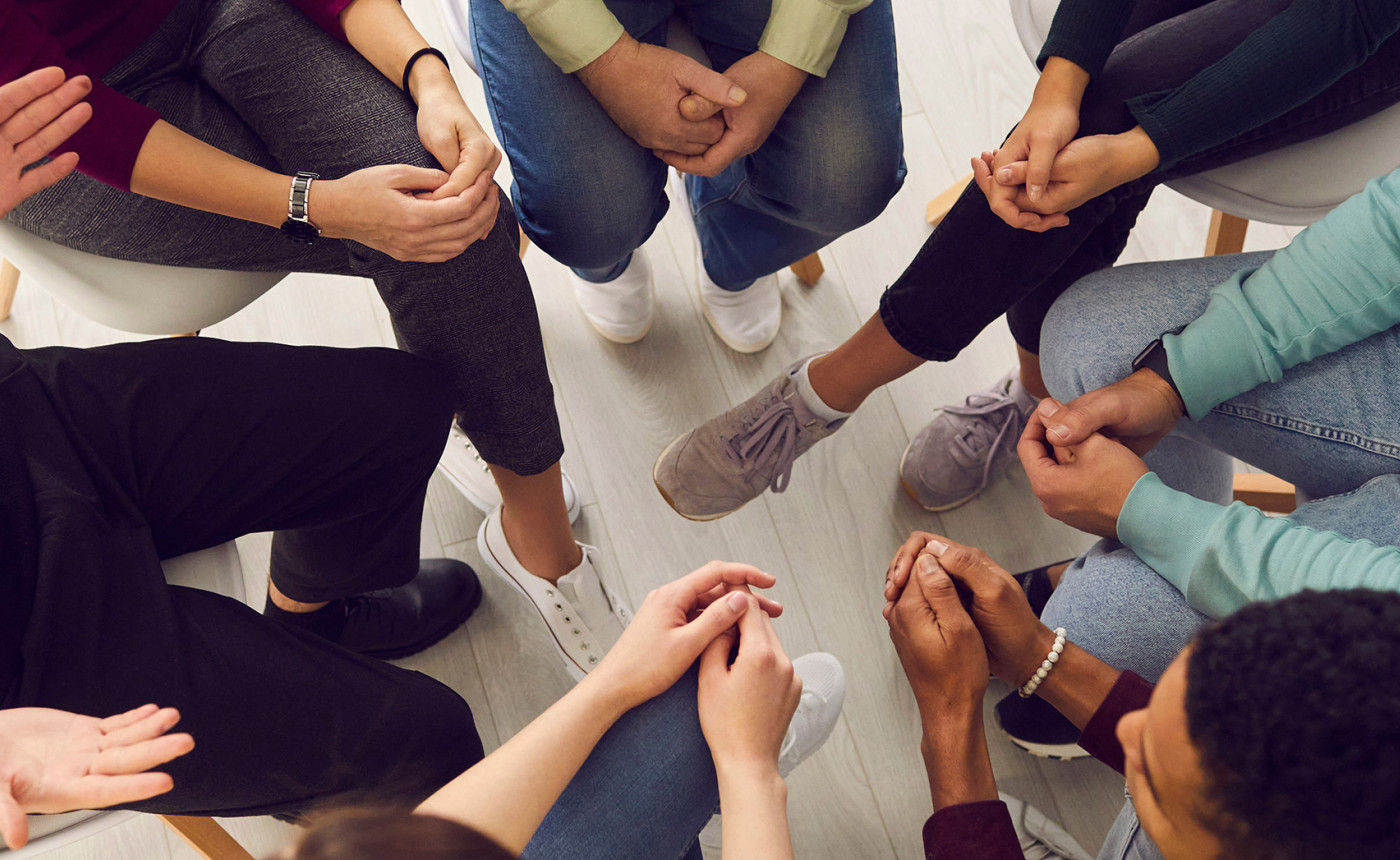 people sitting in a circle, viewed from above