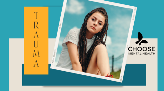 A young caucasian woman in long braids and t-shirt sits outside